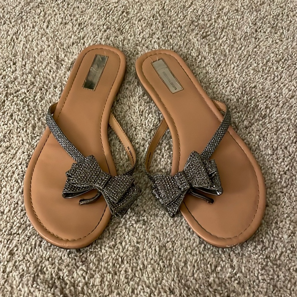 Sparkly bow flip flops.